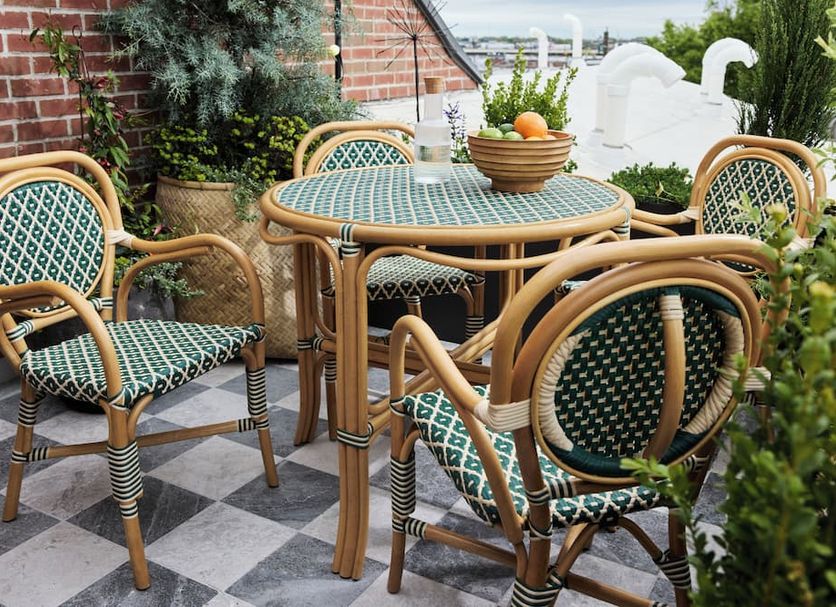 Hotel Anna & Bel rooftop terrace with wicker chairs and table in Philadelphia