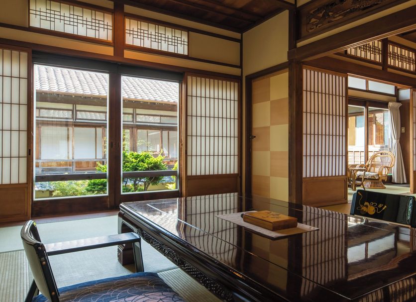 Nagomi no Yado Kakujoro room with tatami seating and garden view in Tahara