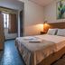 Foz Central Budget Hotel room in Foz do Iguaçu with double bed, bedside lights and window