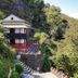 Everest Manla Resort in Nagarkot, hillside hotel with red-and-white exterior amid lush greenery