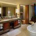 Hilton Qingdao Golden Beach bathroom with soaking tub and balcony ocean view in Qingdao