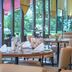 Best Western Macrander Hotel Frankfurt/Kaiserlei restaurant with glass walls and set dining tables in Offenbach am Main