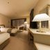 Akiu Resort Hotel Crescent in Sendai, guest room with two beds, desk, lamps and window seating