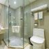 City Comfort Inn Foshan Zumiao Zhangcha bathroom with glass shower, wall-mounted sink and toilet in Foshan