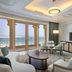 Waldorf Astoria Ras Al Khaimah suite with sea-view balcony and seating area