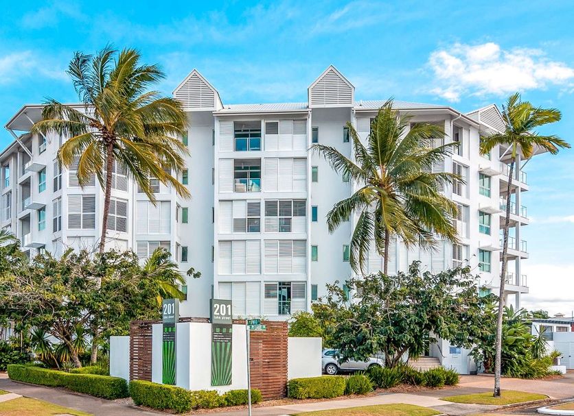 201 Lake Street, Cairns: white 4-story hotel with palm trees and blue sky