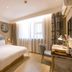 Home Inn Dalian Jinzhou Railway Station Stadium room with king bed, desk, and large window in Dalian