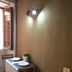 Do-Do Navona Suites Rome room with small dining table, two chairs, and window light