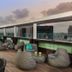 NYX Tel Aviv rooftop terrace with seating and city skyline views at sunset