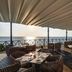 Hideaway at Royalton Negril, Negril: oceanfront terrace dining with wicker seating and sunset views