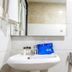 OYO 1594 Hotel Landmark, Visakhapatnam bathroom sink with mirror, toiletries and shower fixture