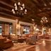 Montage Deer Valley in Park City lobby lounge with wood-beamed ceiling, chandeliers, and seating area