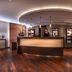 Steigenberger Hotel Treudelberg Hamburg reception desk in a warmly lit hotel lobby