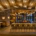W Punta Cana, All-Inclusive in Uvero Alto: stylish bar lounge with sculptural ceiling and tall windows