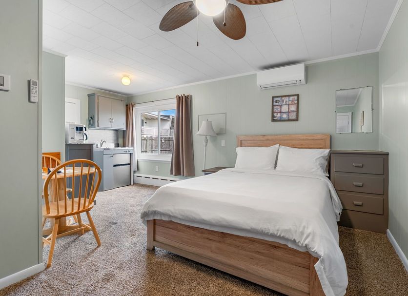 Echo Motel, Old Orchard Beach room with bed, kitchenette, chair, and window view