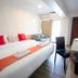 Wild Orchid Villa Bangkok room in Bangkok with two beds, orange runner, desk and chair