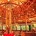 Le Plaza Hotel in Port Au Prince with a warm wood-beamed lobby and central chandelier