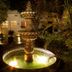 Los Milagros Hotel in Cabo San Lucas features a lit courtyard fountain at night