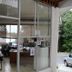 Hotel Coco Beach in Manuel Antonio entrance with glass doors and partial ocean view