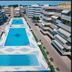 Residence Valbella in Bibione with three outdoor swimming pools between apartment buildings