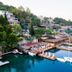 Baldan Suites Hotel & Restaurant in Bozburun, waterfront terraces and sailboats beside a calm bay