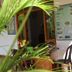 Thirumalai Park, Nilaveli: shaded outdoor hotel seating area with chairs and wall map display
