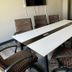 Baymont by Wyndham Laredo meeting room with white conference table and patterned office chairs