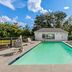 Baymont by Wyndham Forest City outdoor pool with lounge chairs and adjacent guest rooms