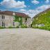 Domaine de Bellevue - Restaurant & Spa in Neufmoutiers-en-Brie, ivy-covered courtyard and stone buildings