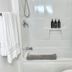 Cribs On The Hill in Picton bathroom with shower-tub combo, white towels, and toiletries