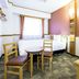 Toyoko Inn Yamagata-eki Nishi-guchi room with two beds, table and chairs, in Yamagata.