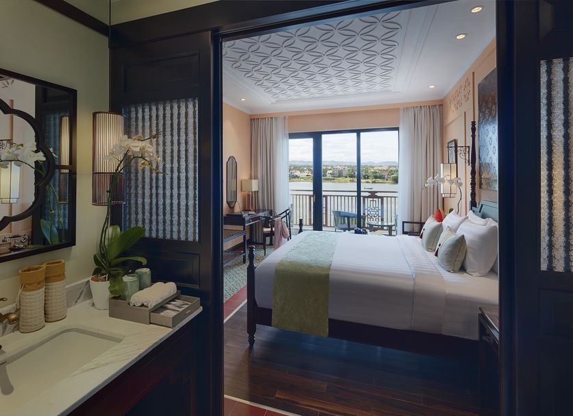 Little Riverside Hoi An luxury hotel room with balcony and river view in Hoi An