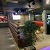 Guijo Suites Makati lobby lounge with seating, digital display, and purple floor lighting in Makati