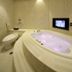 Wego Hotel - Linsen in Taipei City bathroom with a lit whirlpool tub and toilet
