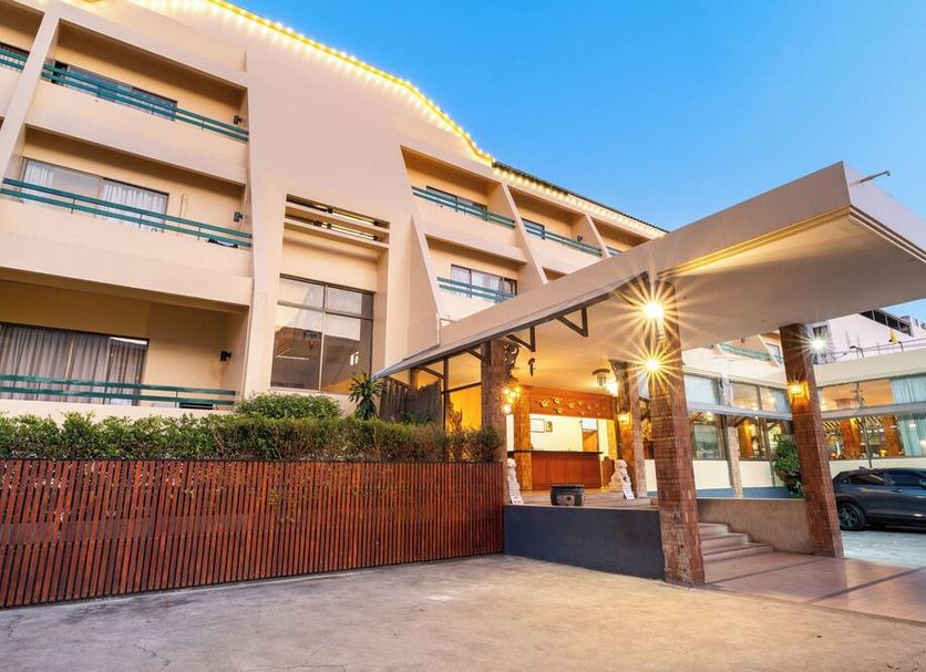 Sirin Hotel Hua Hin exterior with covered entrance and parked car in Hua Hin
