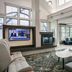 Residence Inn by Marriott Lincoln South lobby with seating area, fireplace, TV and large windows