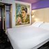 Ibis Styles Honfleur Centre Historique guest room with double bed and Frida Kahlo-style wall art