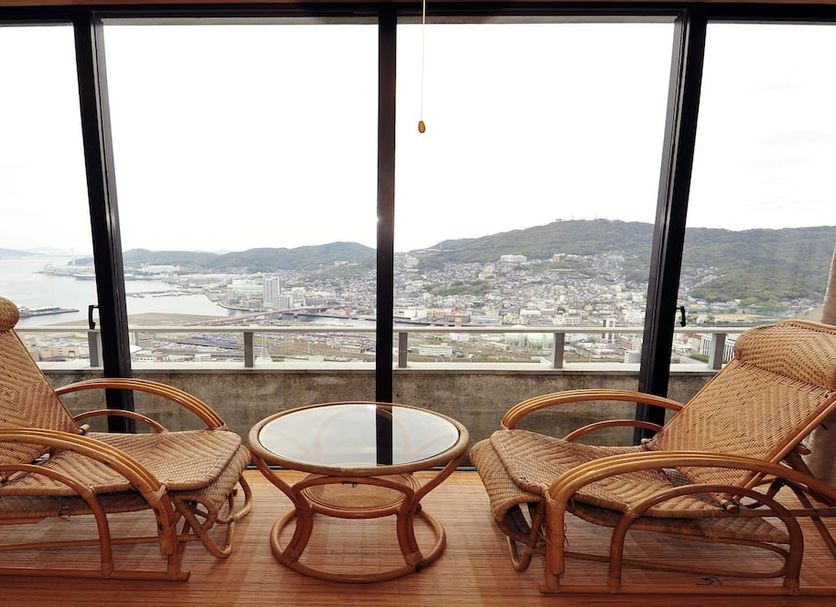 Nisshokan Bettei Koyotei in Nagasaki with twin rattan chairs and a bay-view window
