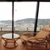 Nisshokan Bettei Koyotei in Nagasaki with twin rattan chairs and a bay-view window