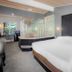 The Inn at Boatworks, Lake Tahoe room with king bed, lake view, and seating area in Tahoe City