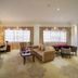 Long Fei Sheng Shi International Hotel in Yan’an, spacious suite sitting area with sofa and large windows