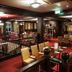 Dillons Hotel in Letterkenny with a red-carpeted restaurant lounge, chandeliers, and dining tables