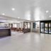 Baymont by Wyndham Arlington At Six Flags Dr lobby with seating and glass doors in Arlington