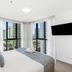 Rhapsody Resort Surfers Paradise room with floor-to-ceiling windows and city views