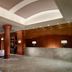 Marriott Jacksonville Downtown lobby with wood columns, marble front desk and lounge seating in Jacksonville