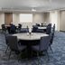 Meeting room at Courtyard by Marriott Houston I-10 West/Memorial in Houston with round banquet tables and chairs