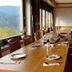 Hotel Schauinsland in Bad Peterstal-Griesbach dining room with long table and mountain-view windows