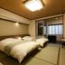 Tosagyoen Kochi guest room with tatami floor, twin beds, and balcony view