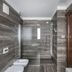Hotel Laurin Salò modern bathroom with walk-in shower, bidet and wood-framed doorway