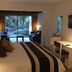 Hotel Acacias De Vitacura room in Santiago with bed, sitting area, and garden view